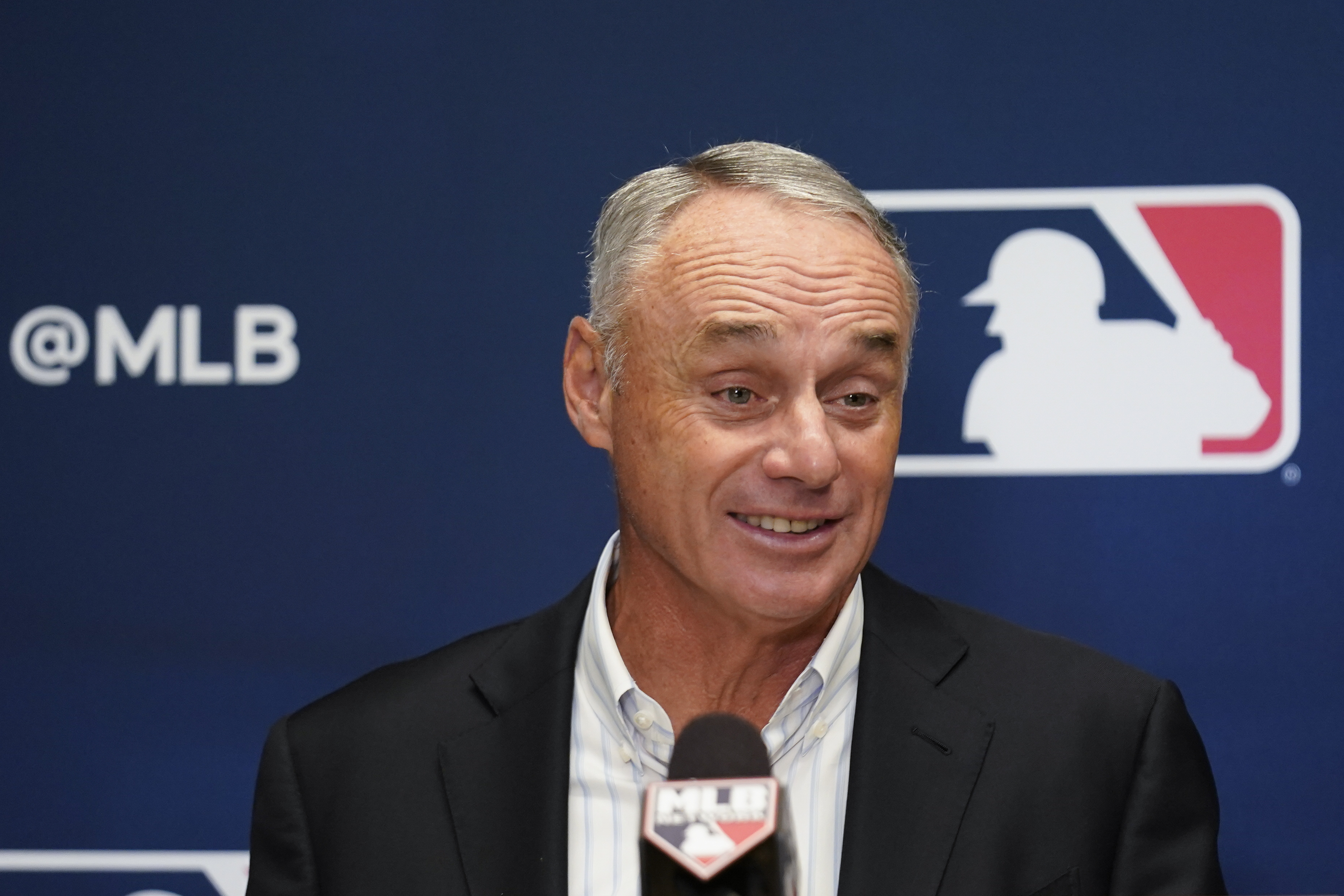Major League Baseball Commissioner Rob Manfred speaks to reporters following an owners' meeting.