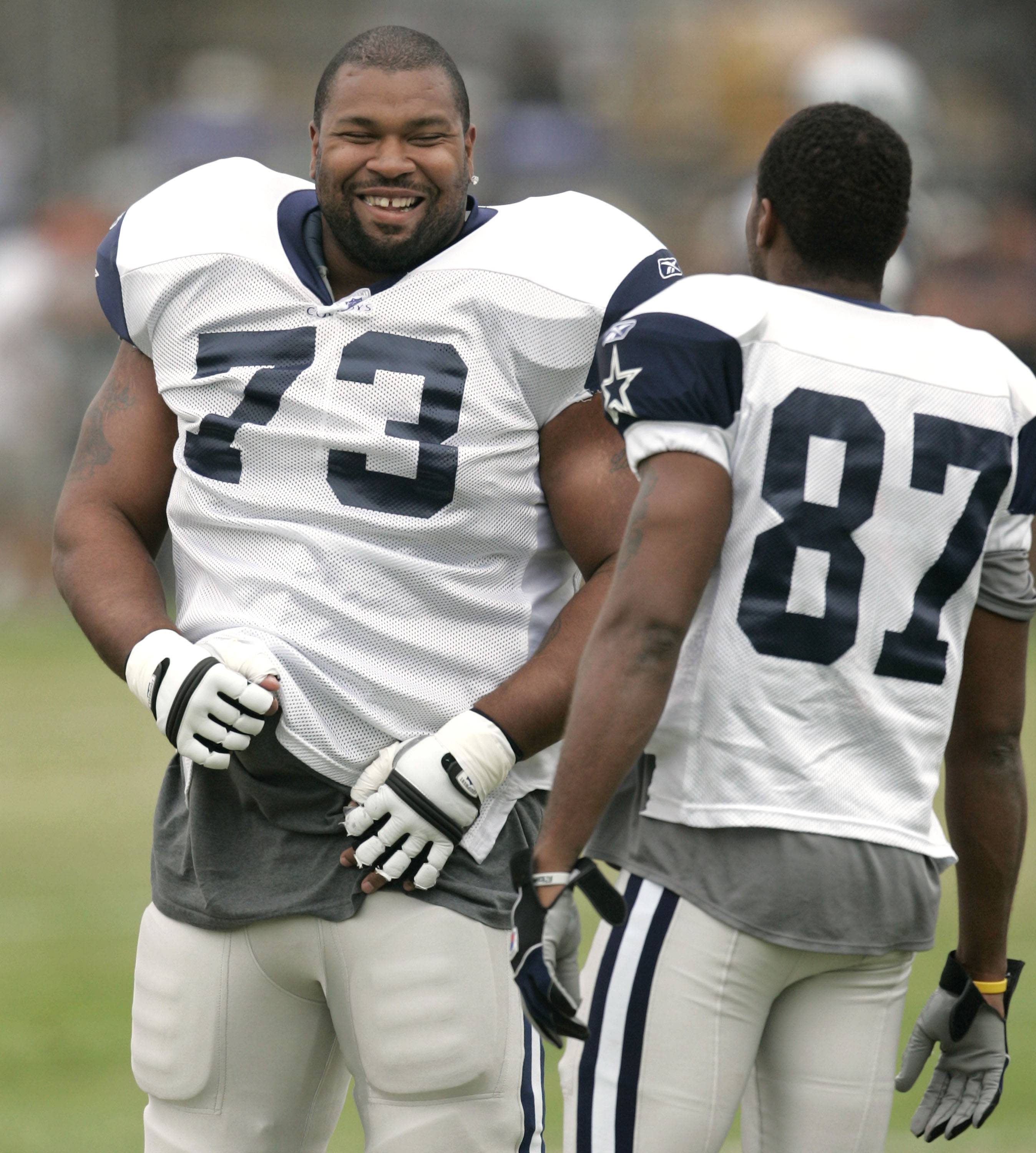 FILE - In this Aug. 1, 2005, file photo, Dallas Cowboys guard Larry Allen (73) shares a laugh.