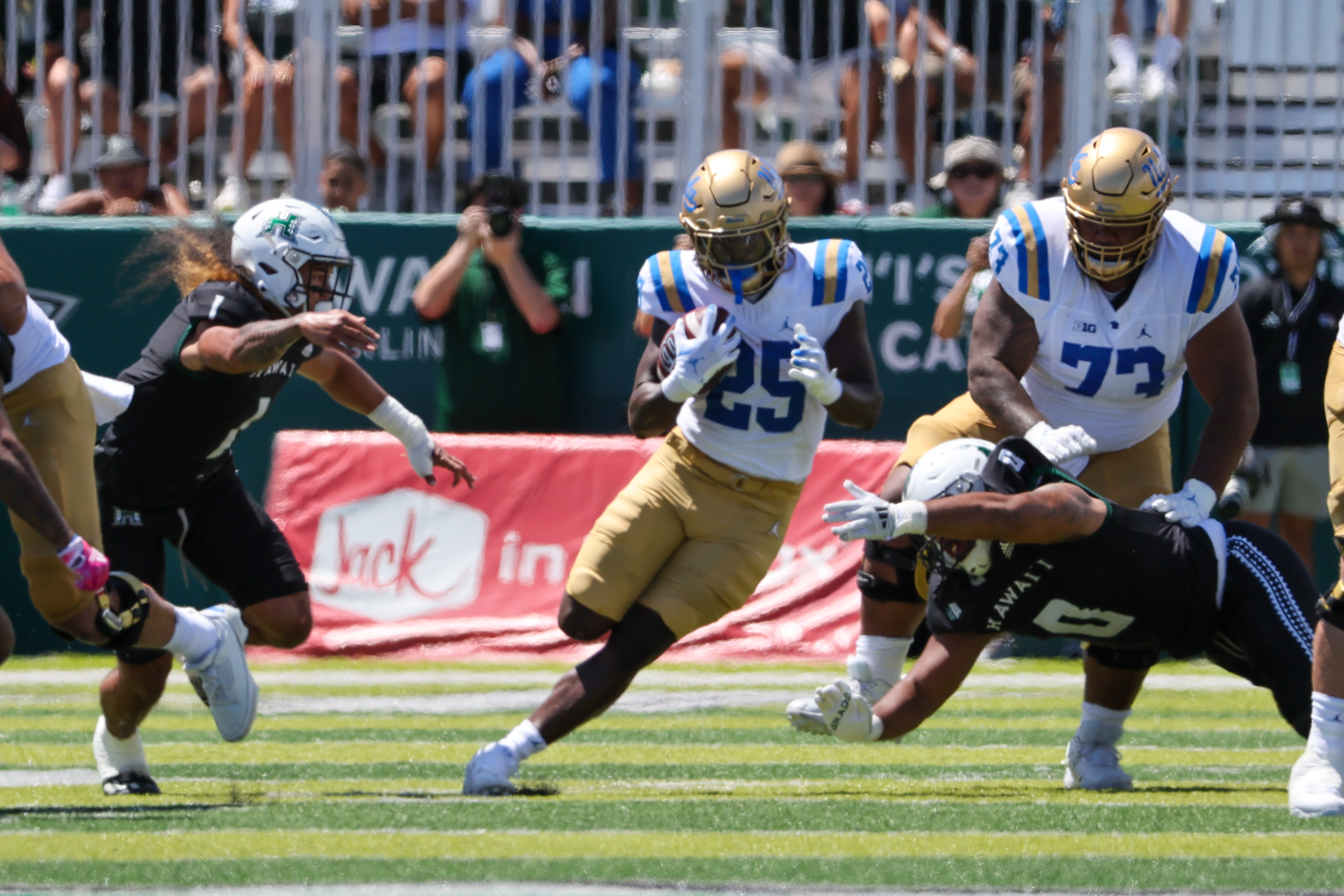 HONOLULU, HI - AUGUST 31: T.J. Harden #25 of the UCLA Bruins runs the ball during the first half.