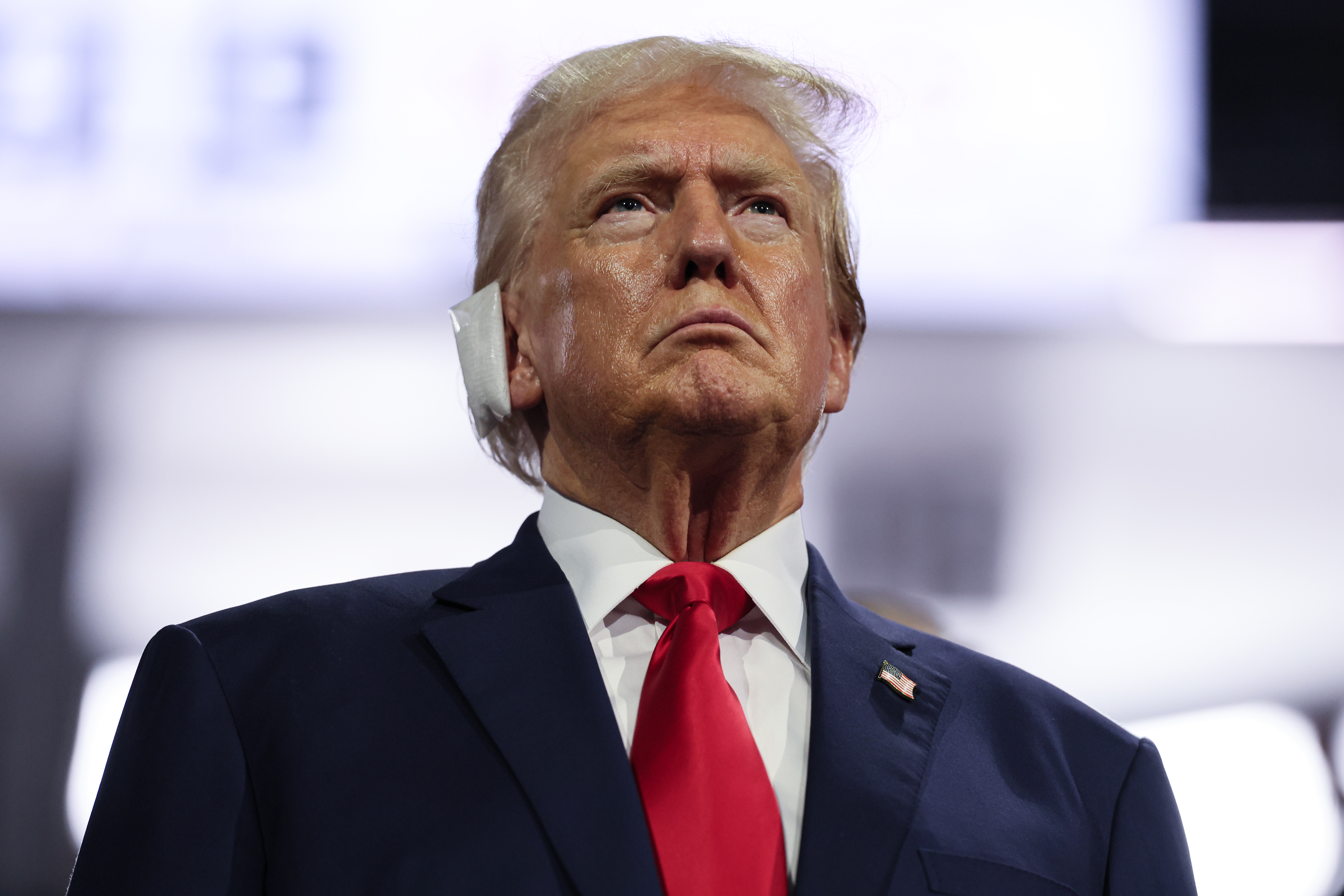 Milwaukee, Wisconsin, Monday, July 15, 2024 - Days after surviving an assassination attempt where a bullet grazed his ear, Donald Trump soaks in the adulation from delegates after being formally nominated as the Republican presidential candidate at the Republican National Convention at Fiserv Forum. (Robert Gauthier/Los Angeles Times)