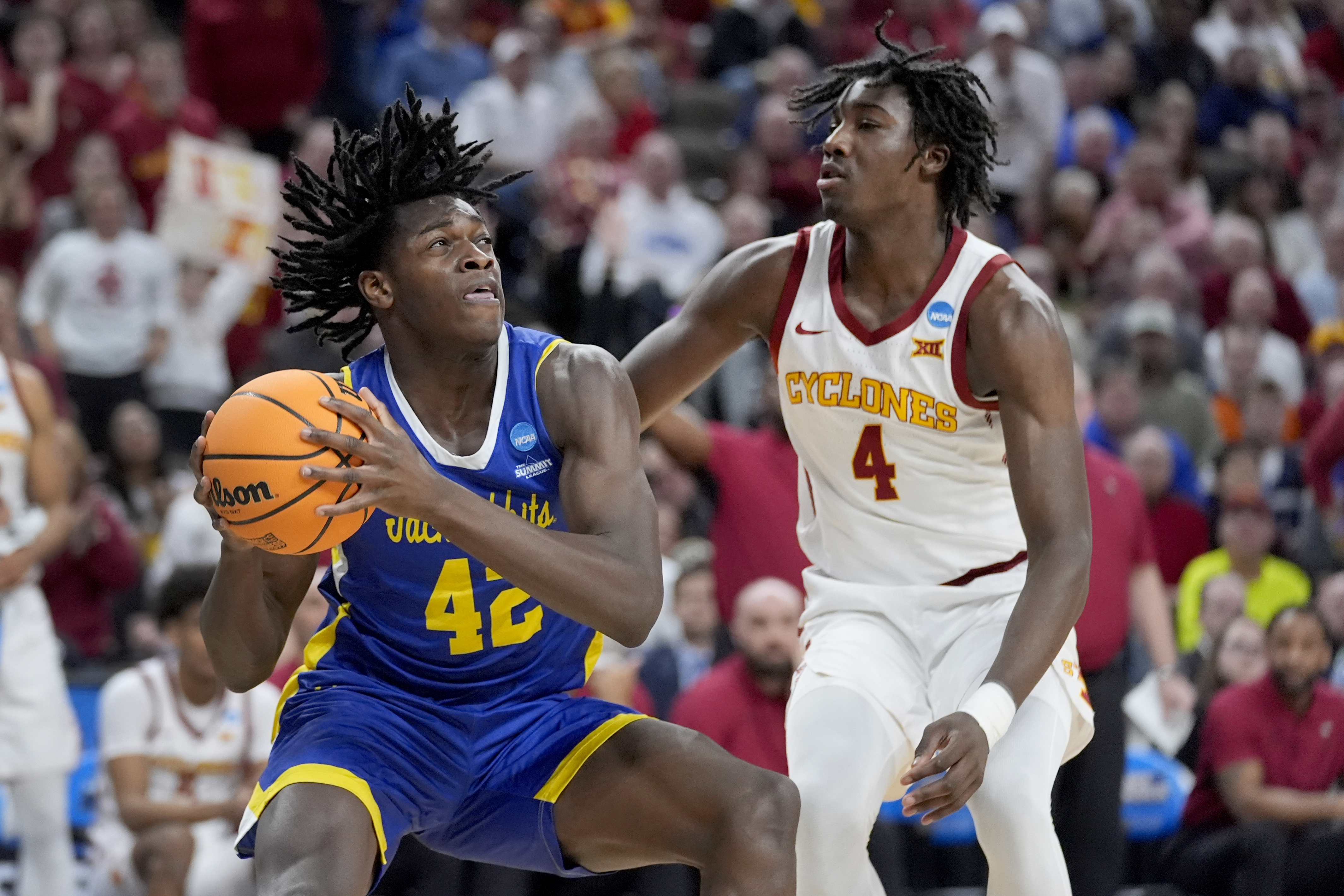 South Dakota State's William Kyle III holds the ball under pressure from Iowa State's Demarion Watson 