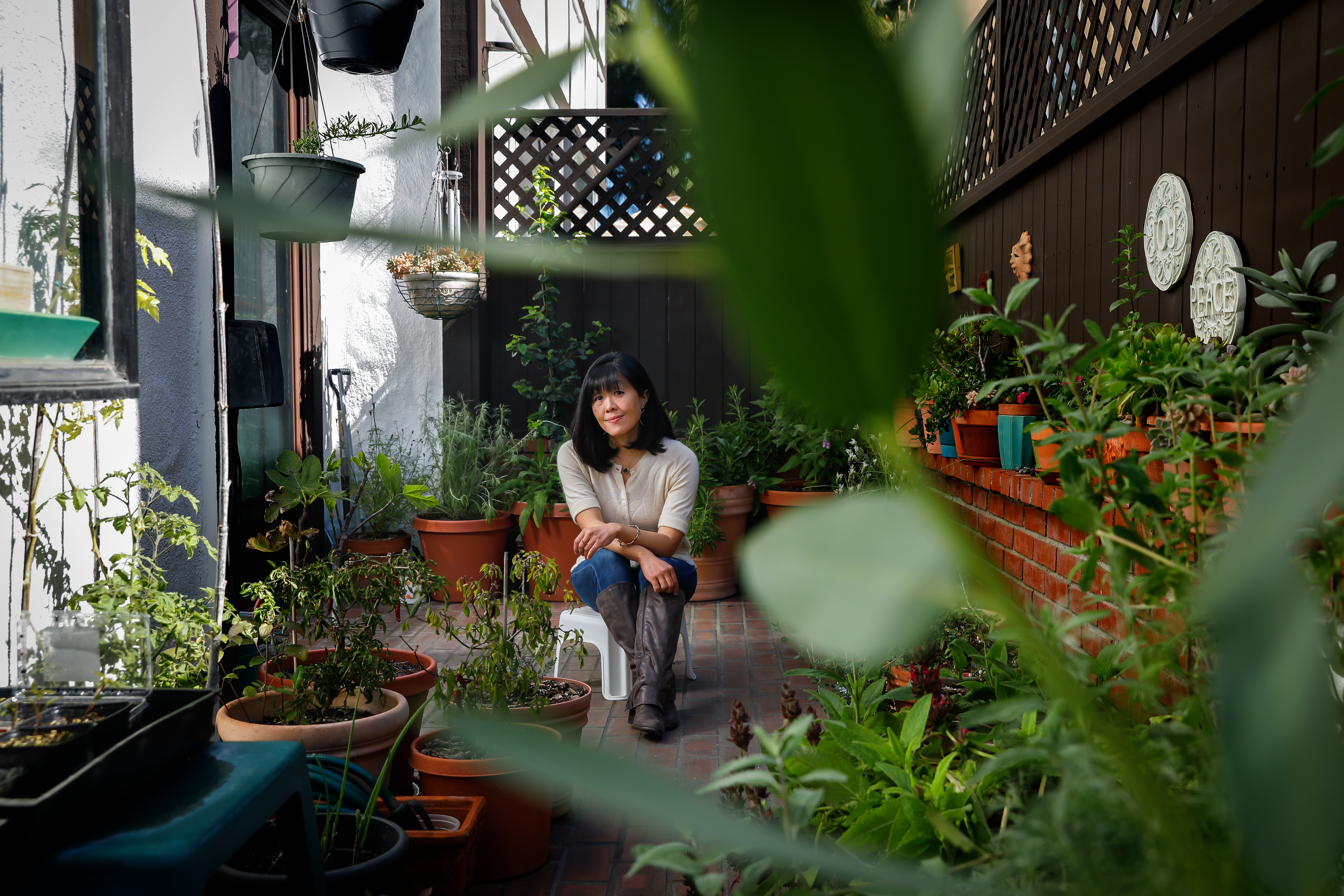 Barbara Chung on her patio in Santa Monica surrounded by her plants.