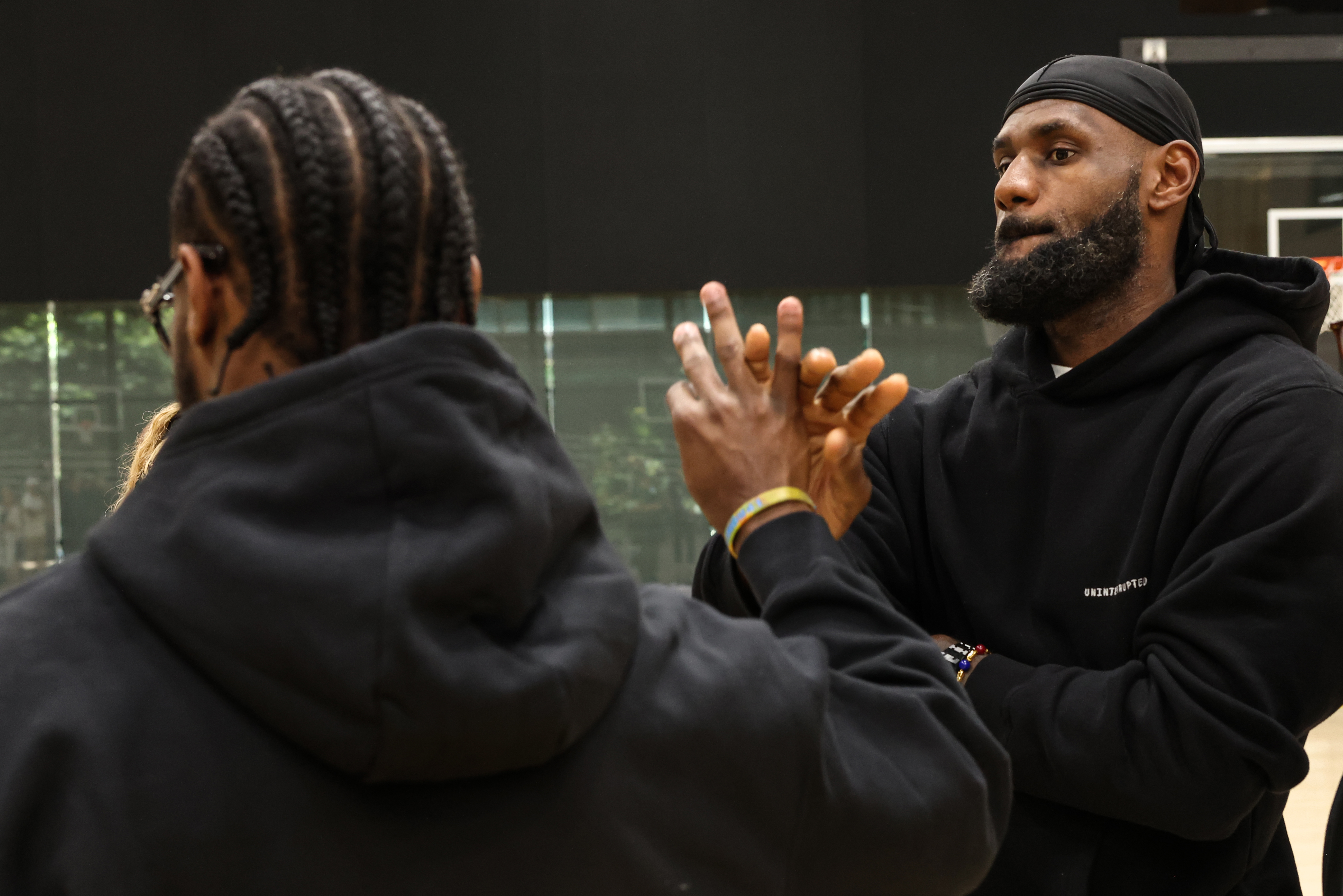 El Segundo, CA, Tuesday, July 2, 2024 - Lakers star LeBron James shakes hands with his son, Bronny after a press conference at the UCLA Health Training Center. (Robert Gauthier/Los Angeles Times)