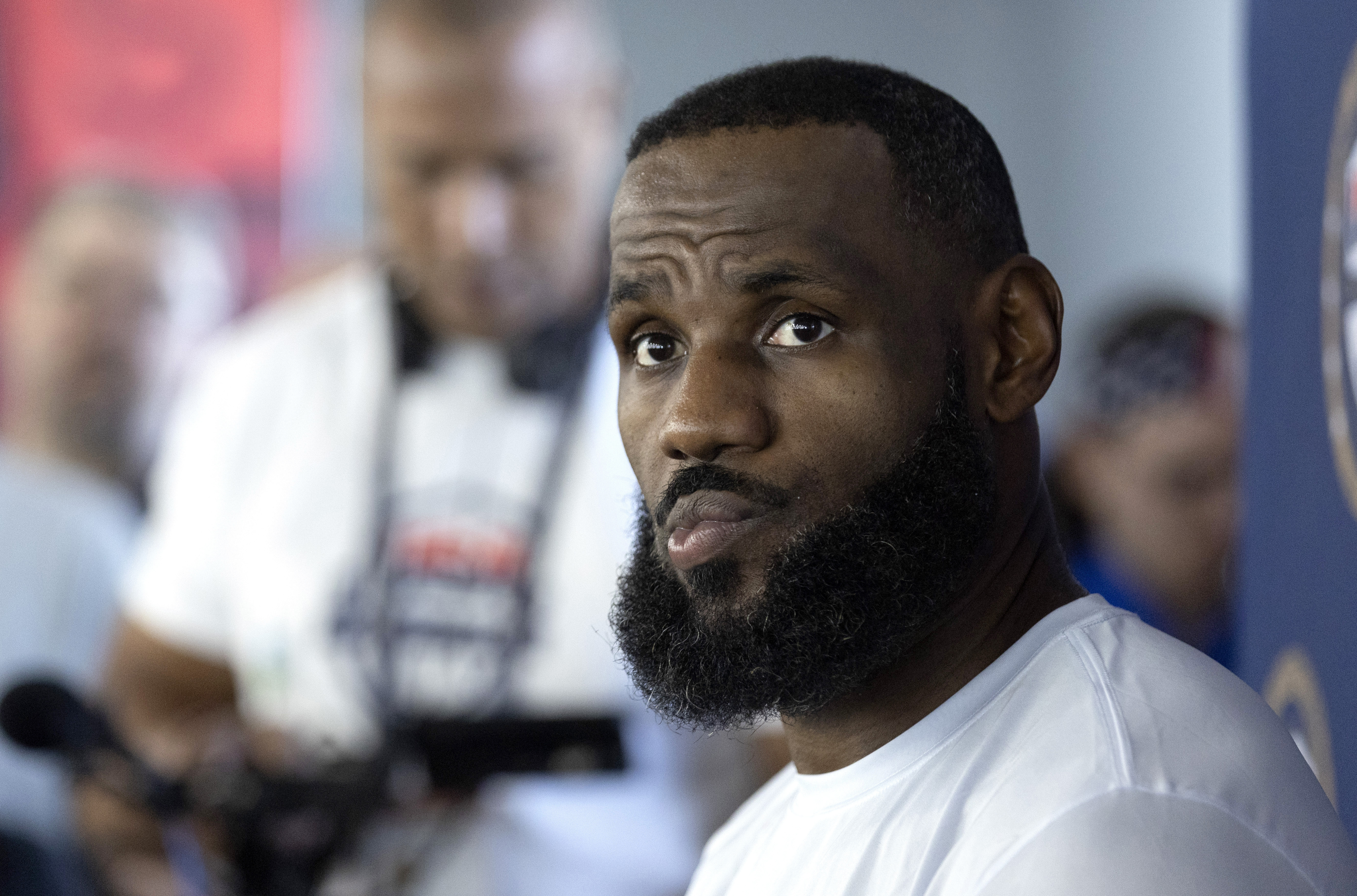 LeBron James of the Los Angeles Lakers listens to a question from a reporter during training camp for the United States men's basketball team Saturday, July 6, 2024, in Las Vegas. (AP Photo/Steve Marcus)