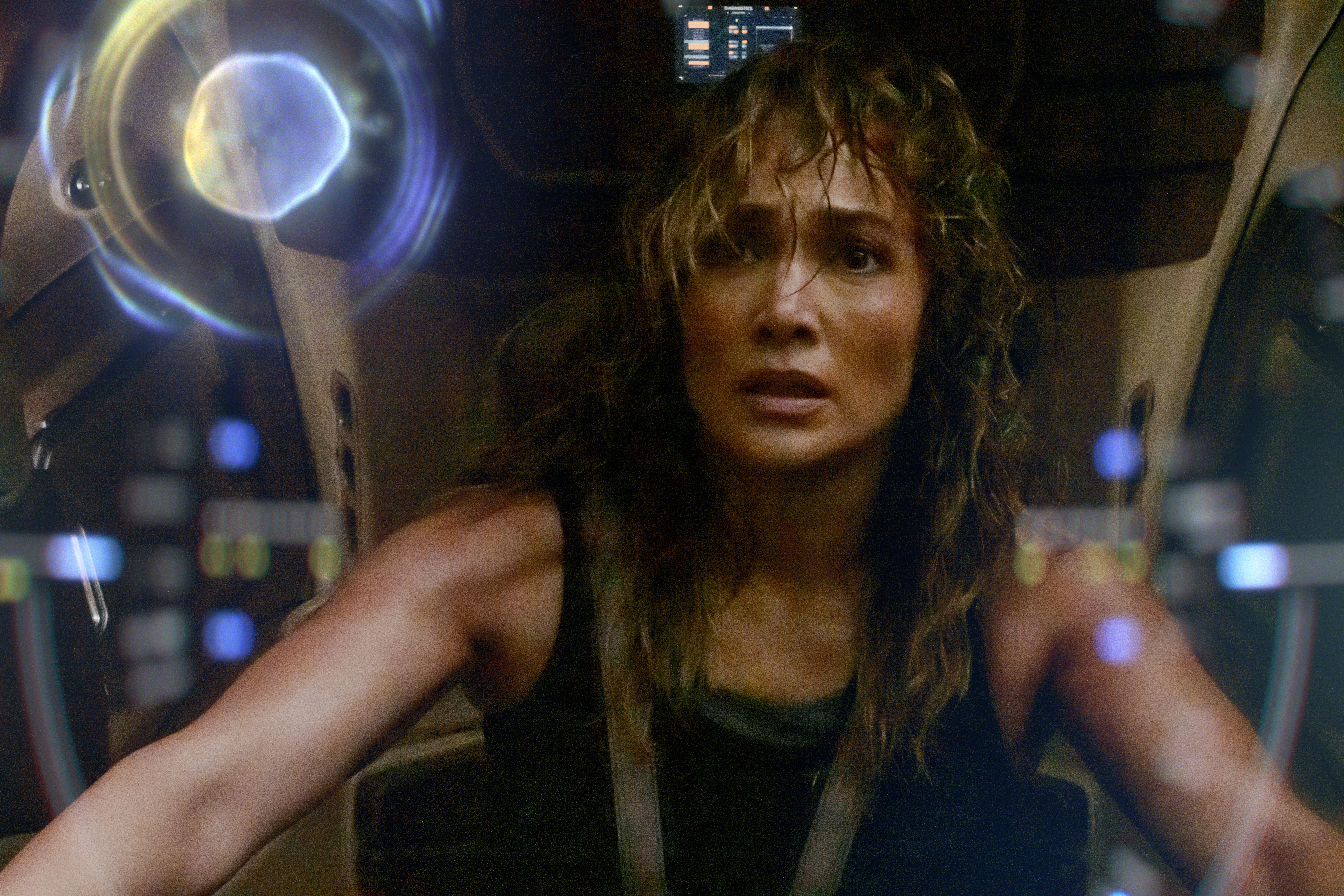 A sweaty, bedraggled woman in a spaceship.