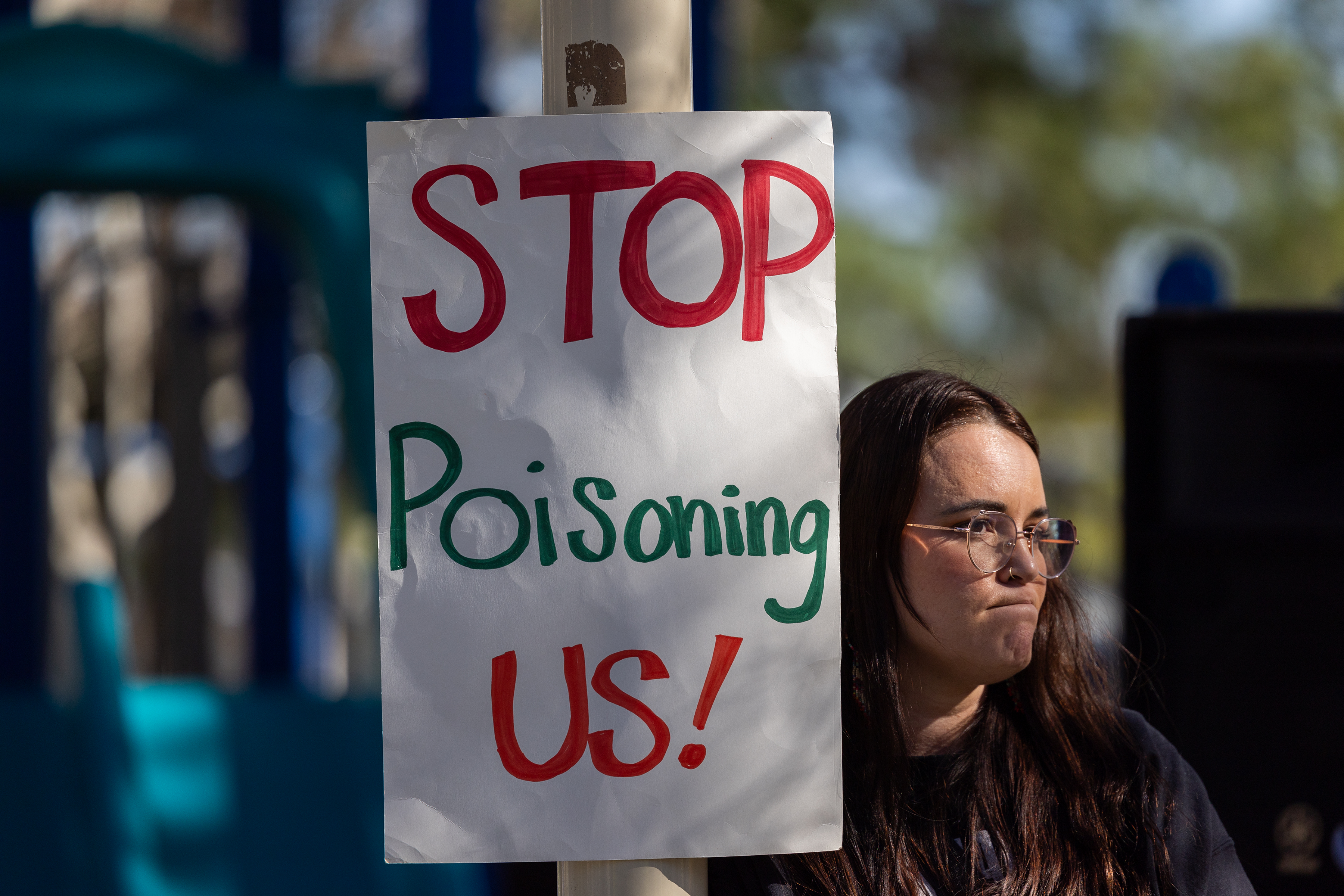 Castaic, CA - February 22: Sarah Olaguez, Citizens for Chiquita Canyon Closure, joins residents of Val Verde and Castaic protesting to call for Chiquita Canyon Landfill to be closed in Hasley Canyon Park in Castaic Thursday, Feb. 22, 2024. Garbage has been burning deep inside the landfill due to a chemical reaction for much of the past year, and recently scalding-hot contaminated water has surged to the surface. The protest follows calls from the County Supervisor Kathryn Barger's office, which said the landfill should provide funds to relocate residents who want to temporarily move until the issue is resolved. (Allen J. Schaben / Los Angeles Times)