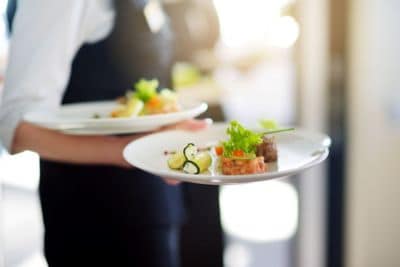 server carrying plate of food