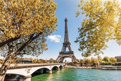 The Eiffel Tower surrounded by fall foliage