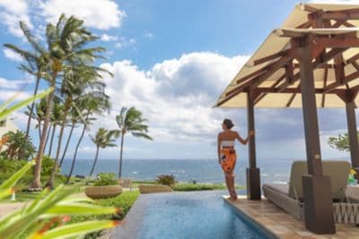 A woman poolside at Wailea resort