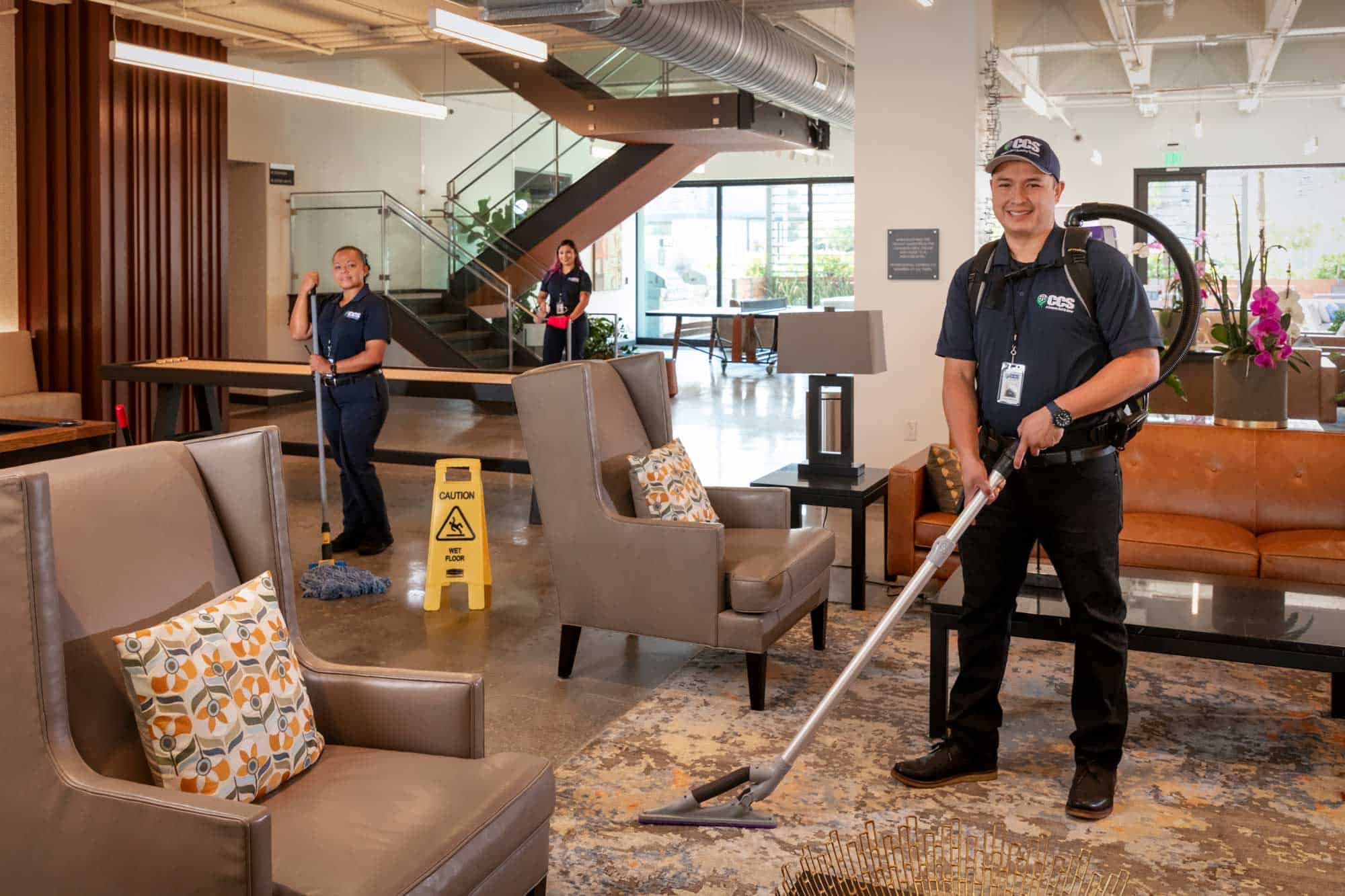 man vaccuuming the carpet