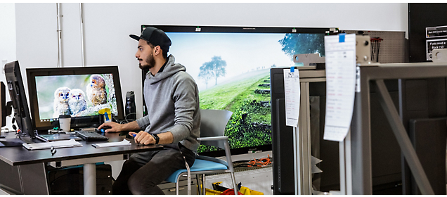 A person sitting at a desk with a computer