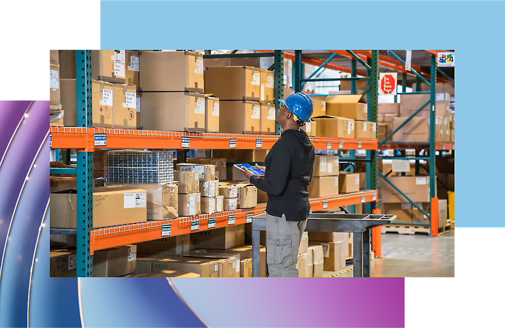 Warehouse employee checking inventory with clipboard.