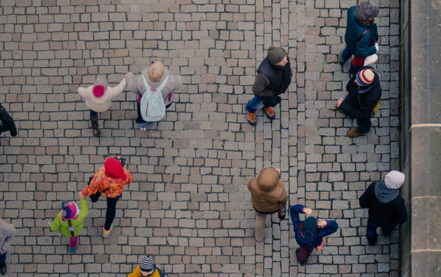 Aerial view of people walking on a street.