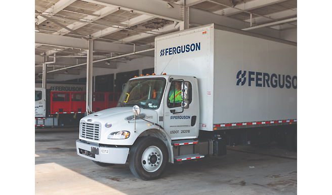 A white Ferguson truck is in a warehouse