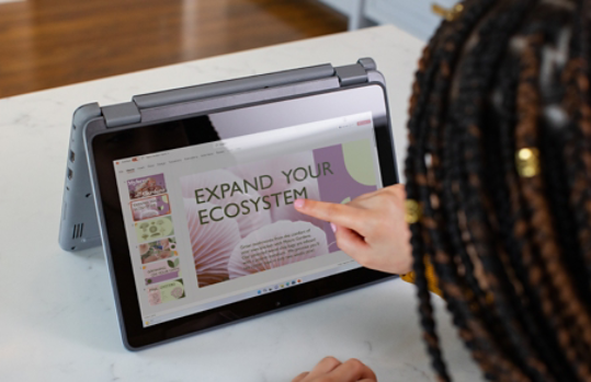 Person pointing to a touchscreen computer