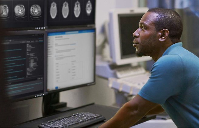 A person sitting in front of a computer