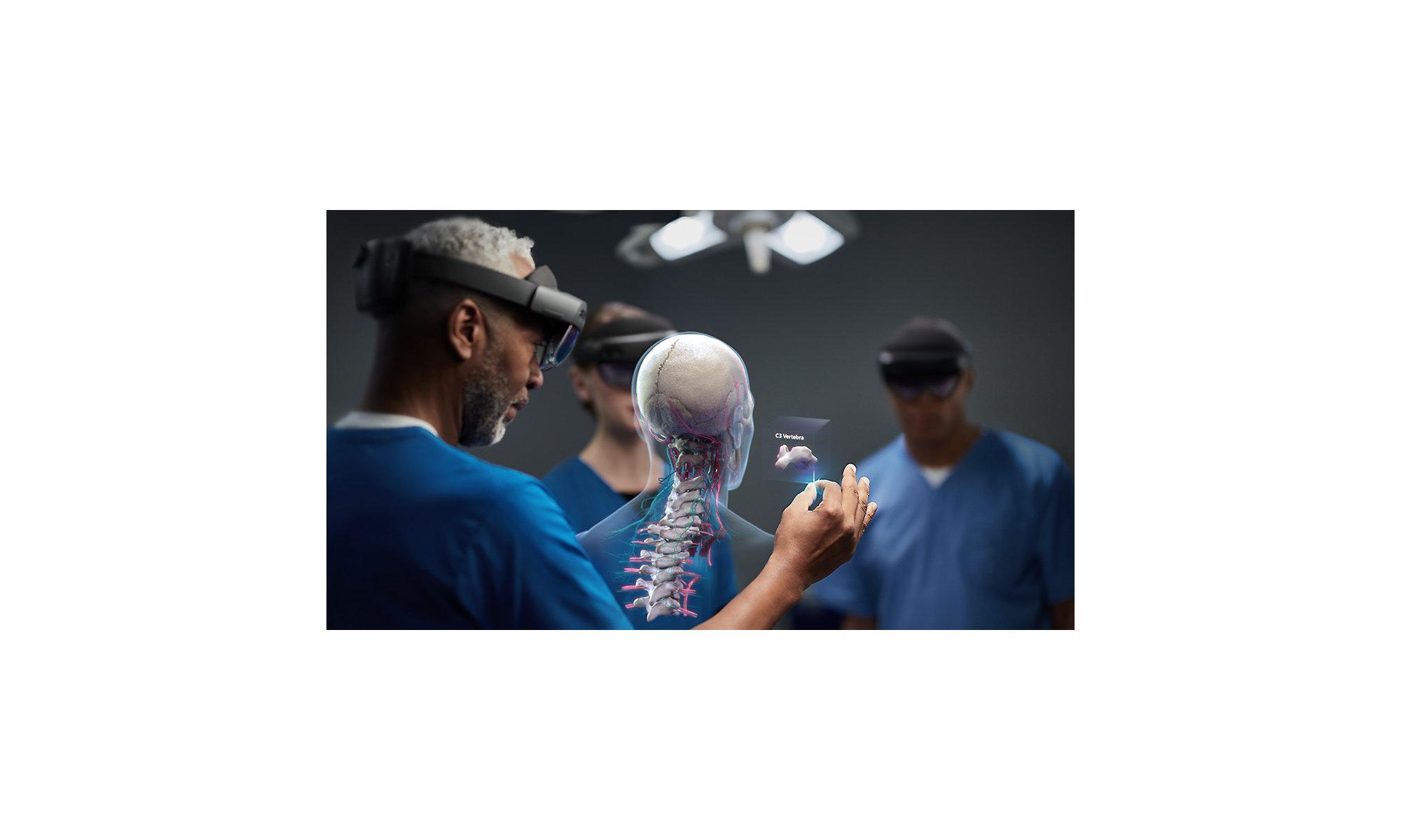 Medical professionals using HoloLens 2 devices to view a human spinal cord.