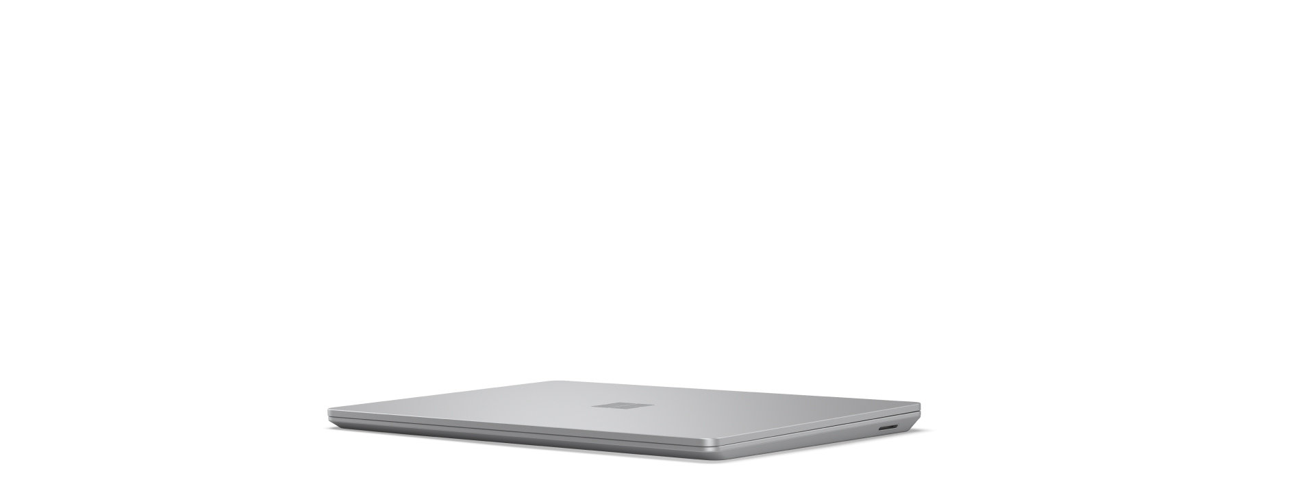 A rotating Surface Laptop Go 3 opening and closing while showing all angles of the device.