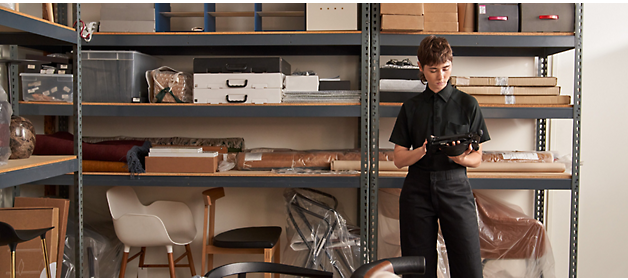 A girl in a black shirt working on tablet