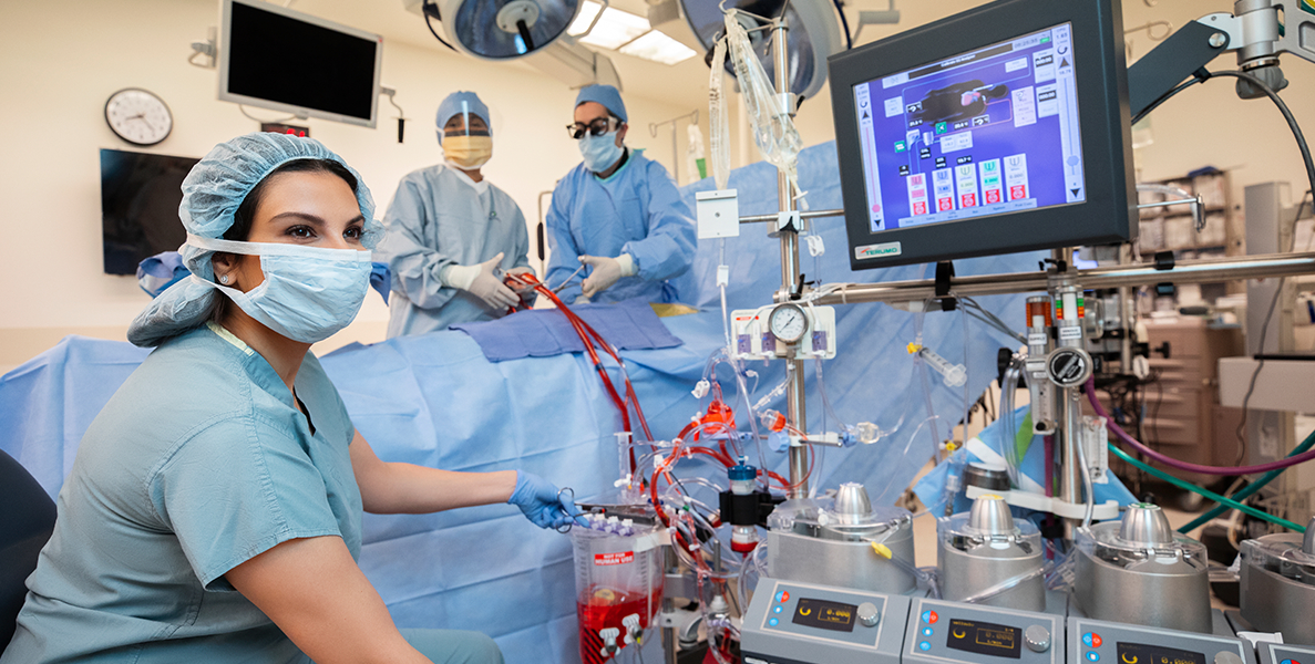 Female surgical nurse assisting surgical team in state-of-the-art operating room