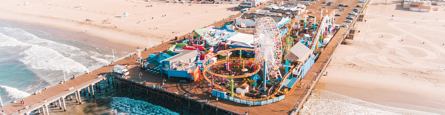 Coin-operated binoculars on Santa Monica pier with city of Santa Monica in the background