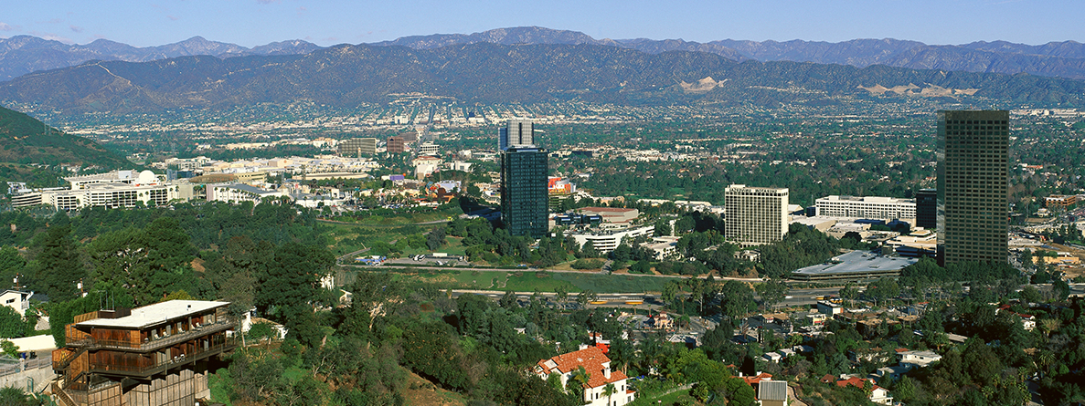 Aerial photo of skyline in the San Fernando Valley with mountains in the background