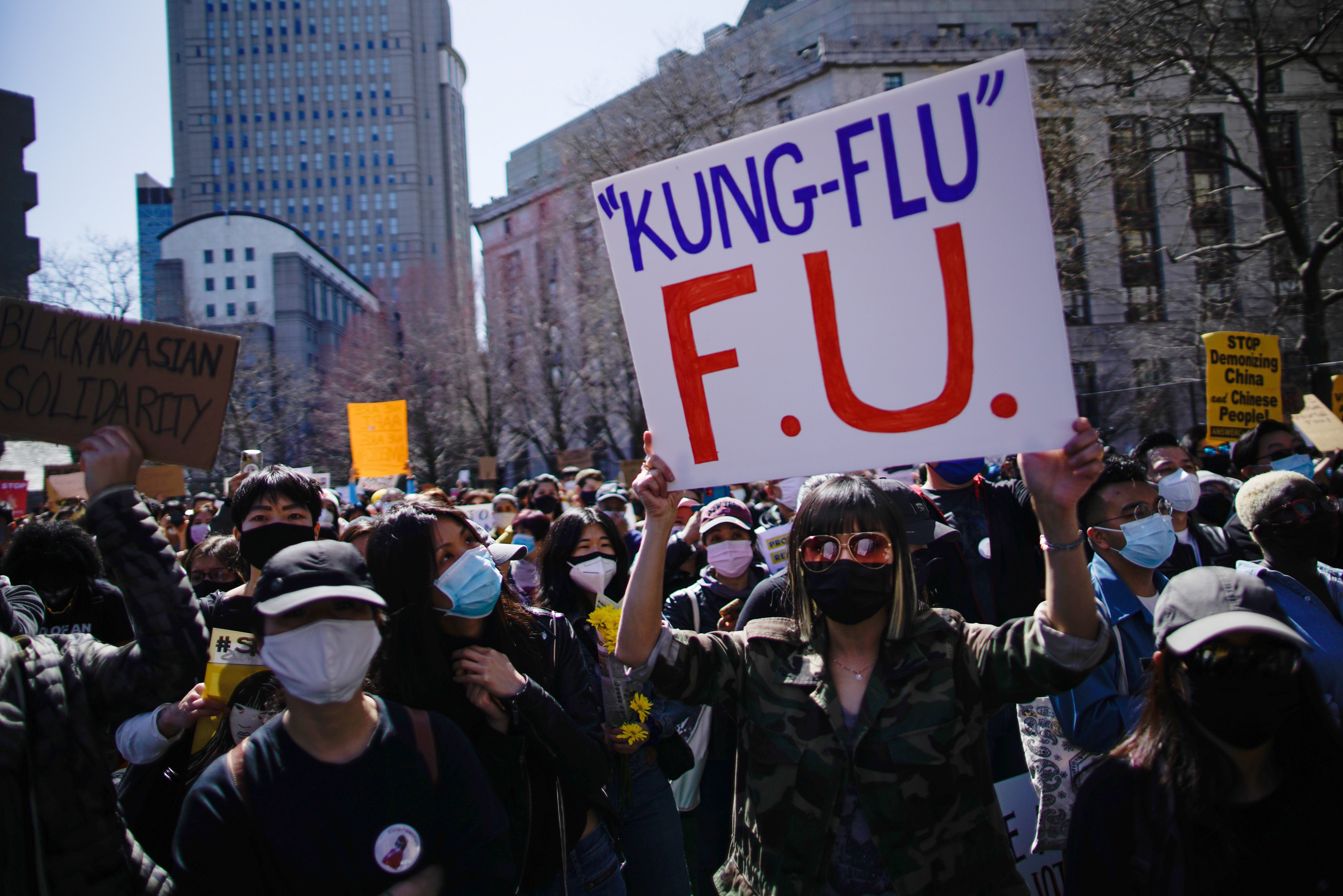 People take part in a rally against hate and confront the rising violence against Asian Americans at Columbus Park in New York, on Sunday, March 21, 2021.