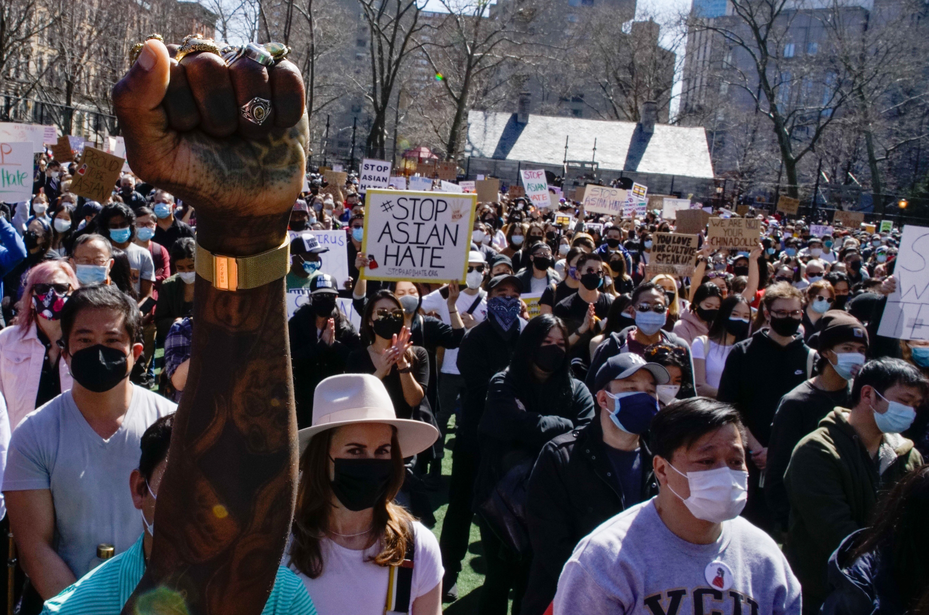 People take part in a rally against hate and confront the rising violence against Asian Americans at Columbus Park in the Chinatown are of New York, on Sunday, March 21, 2021.