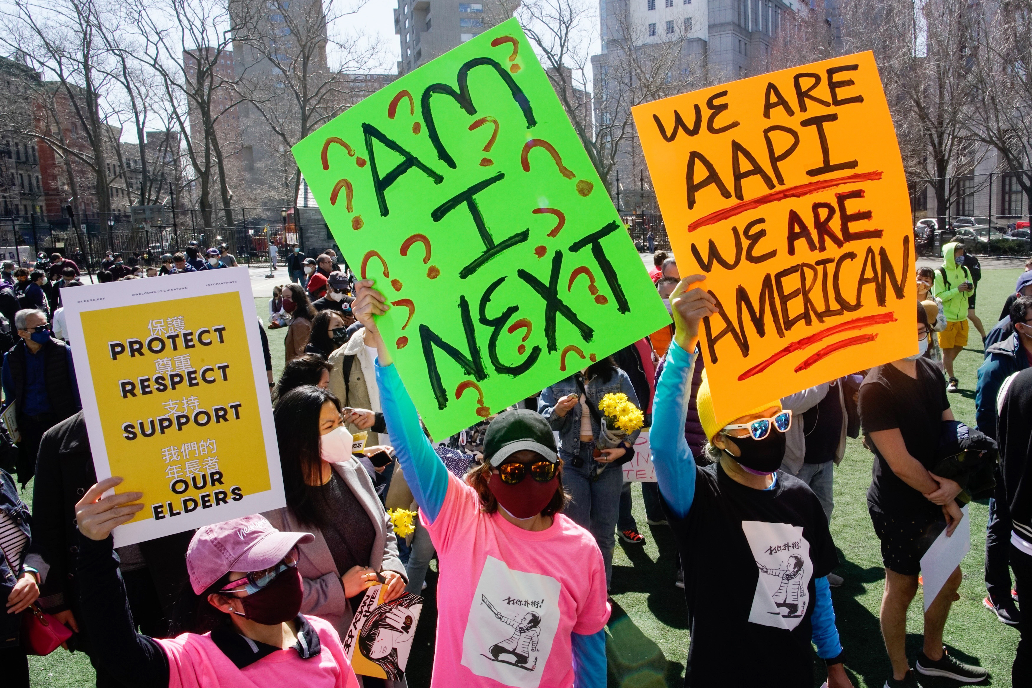 People take part in a rally against hate and confront the rising violence against Asian Americans at Columbus Park in New York, on Sunday, March 21, 2021.