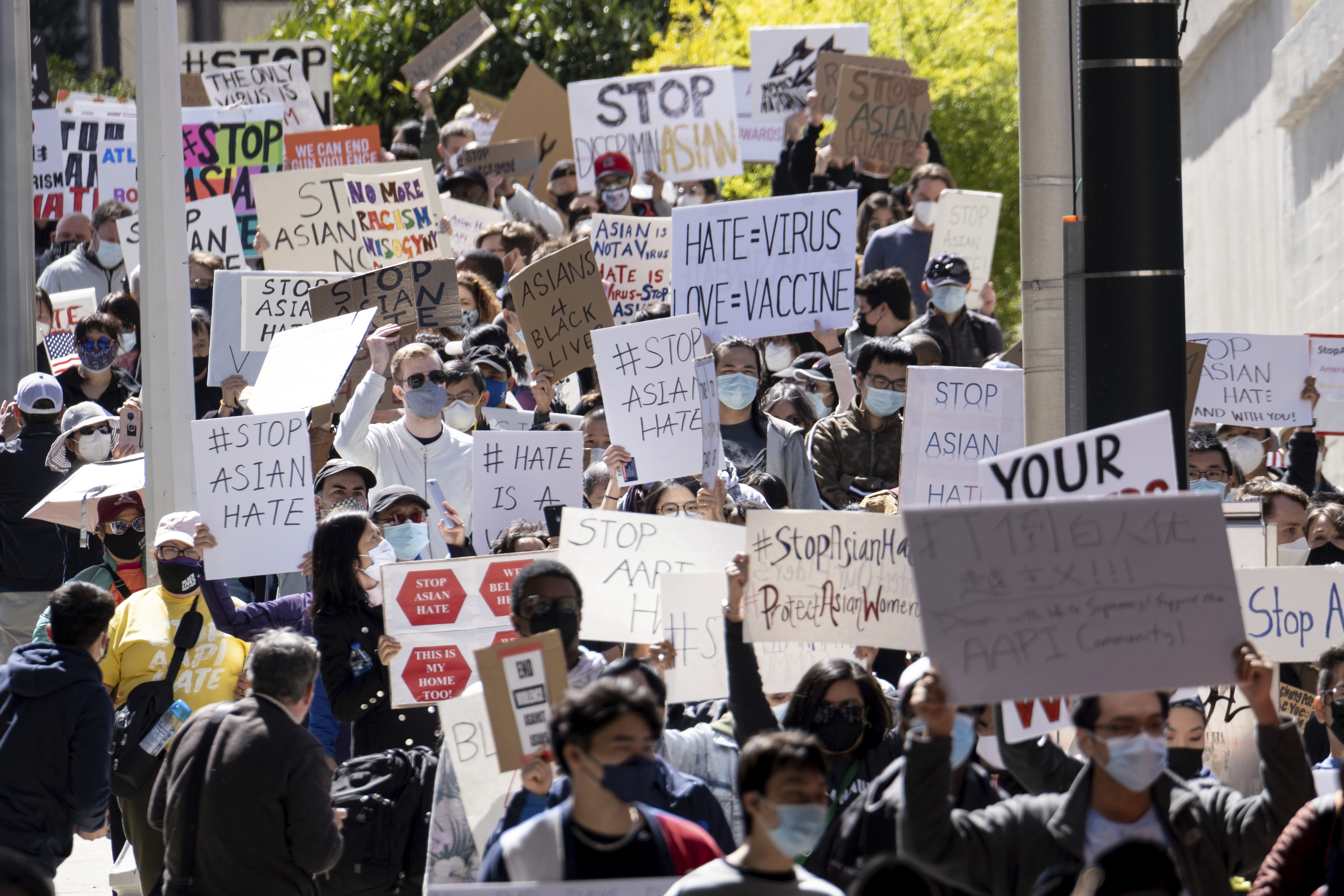 People march away from the Georgia State Capitol in Atlanta during a unity "Stop Asian Hate" rally Saturday afternoon, March 20, 2021.