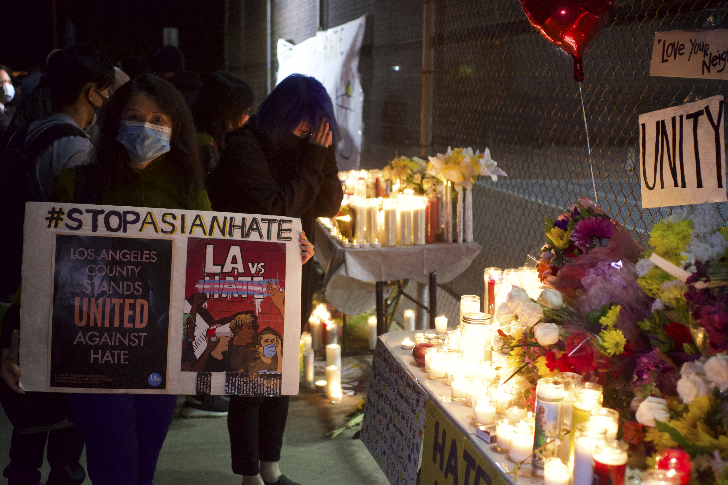 People gather at a rally "Stop Asian Hate" candlelight vigil at Almansor Park in Alhambra, Calif., Saturday night, March 20, 2021.