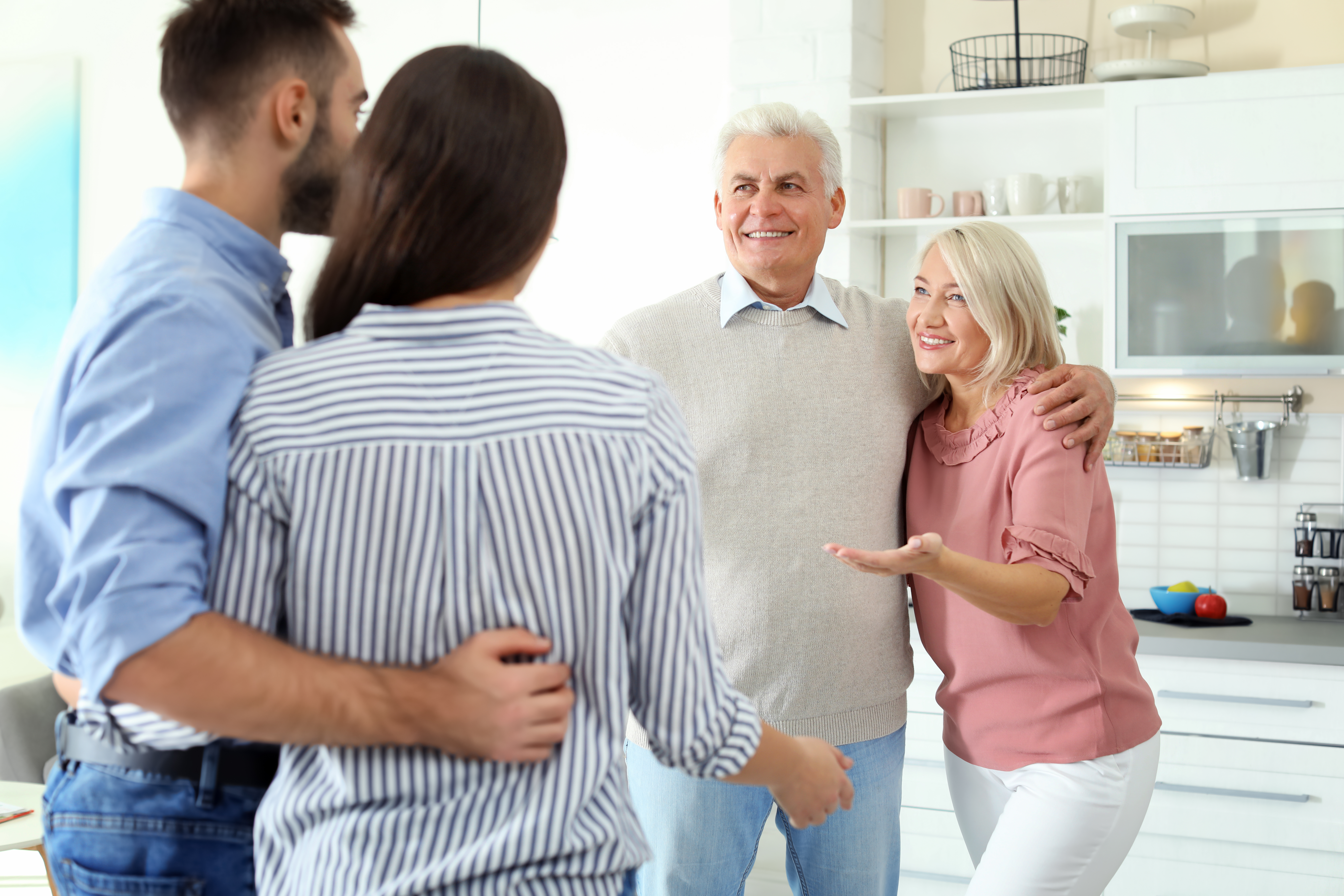 A couple chatting with their parents | Source: Shutterstock