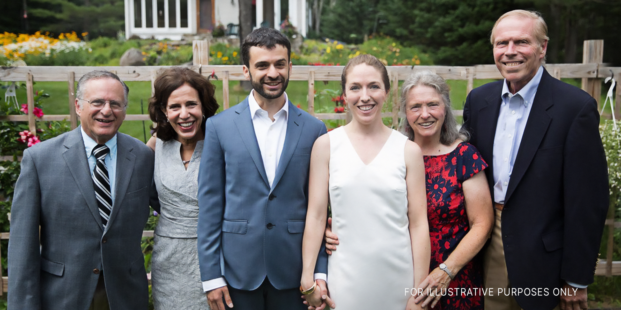 People posing for a photo in a wedding ceremony | Source: Flickr.com/ericrossrosenbaum/"parents" (CC BY 2.0)