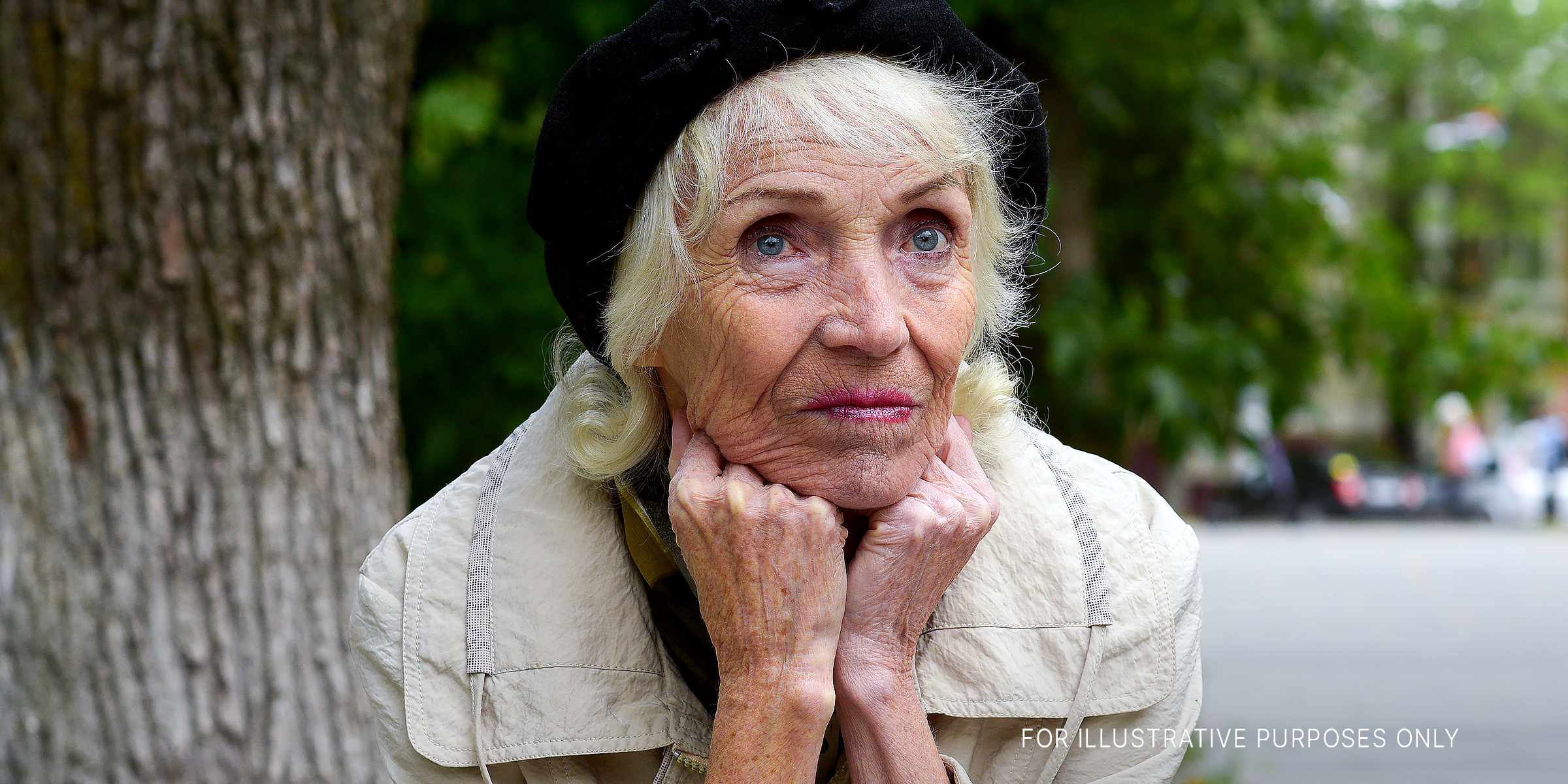 An old woman with her hands under her chin | Source: Getty Images