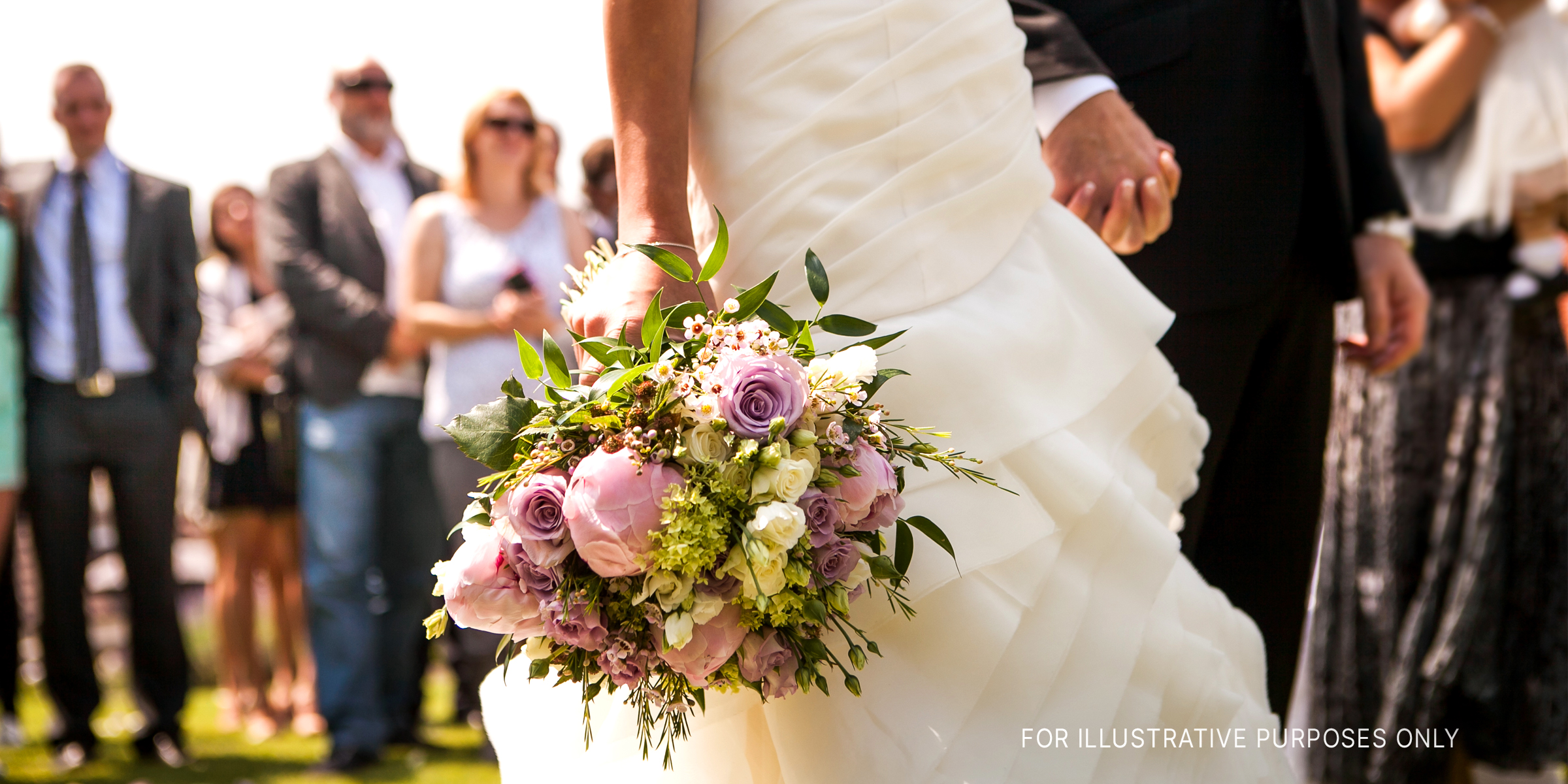 A bride and groom holding hands at their wedding | Source: Shutterstock