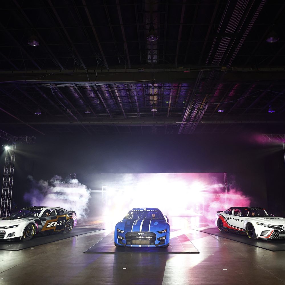 Three Next Gen NASCAR Cup cars on stage