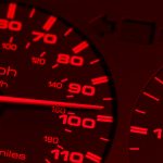 Stock photo of extreme close-up of redline speedometer.