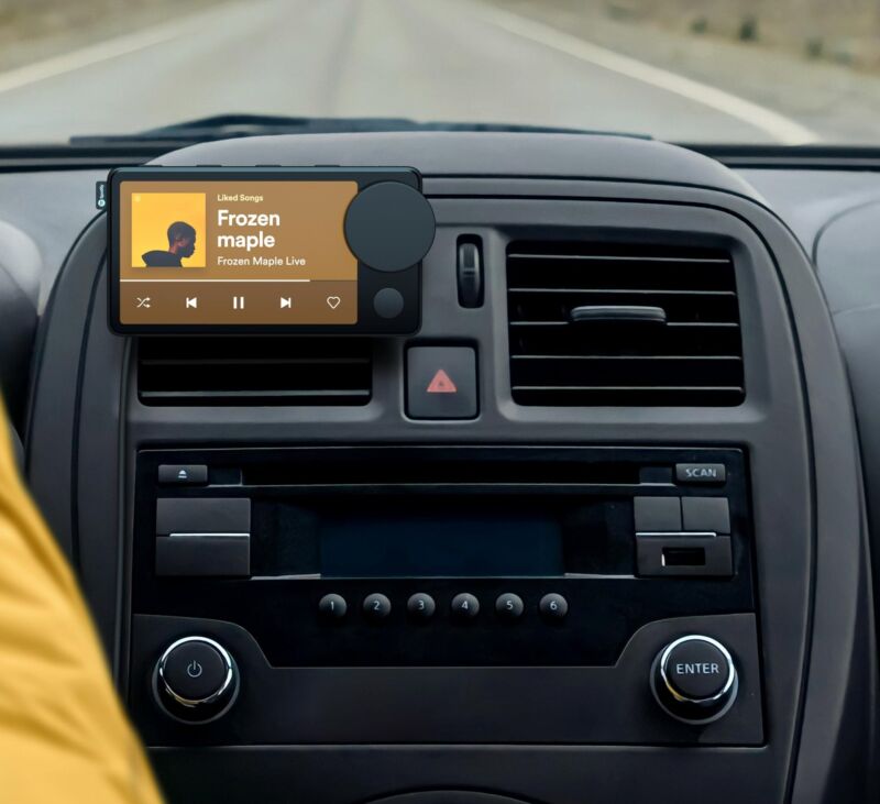 Spotify's Car Thing in a car. 