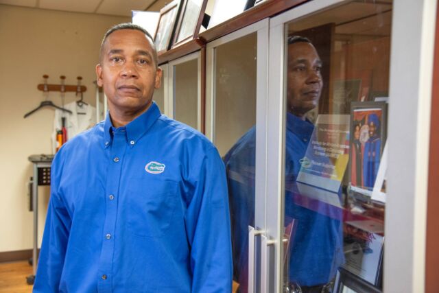 Computer science professor Juan Gilbert stands in his office at the University of Florida. After spending nearly 20 years developing a new voting machine, Gilbert issued a simple challenge: Hack my machine.