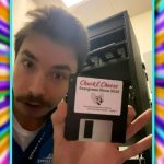 Stewart Coonrod holds up an official 2023 Chuck E. Cheese floppy disk in a TikTok video. It contains dance moves for in-store animatronics.