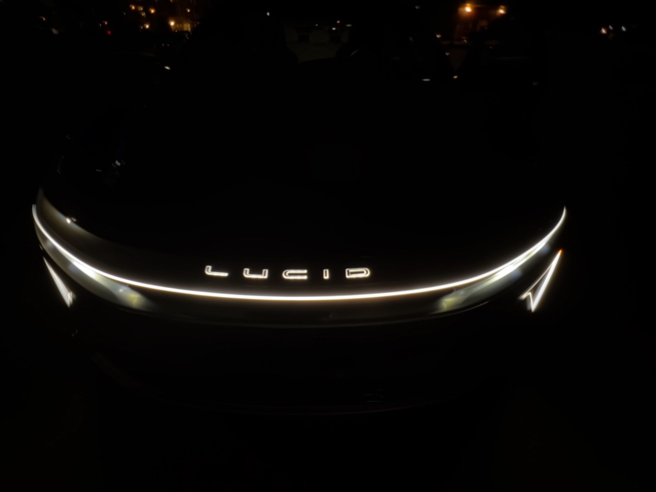 Lucid Air front badge at night