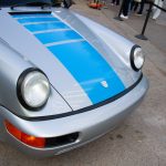 The front of a silver porsche 911