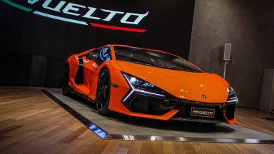 An orange Lamborghini Revuelto on display