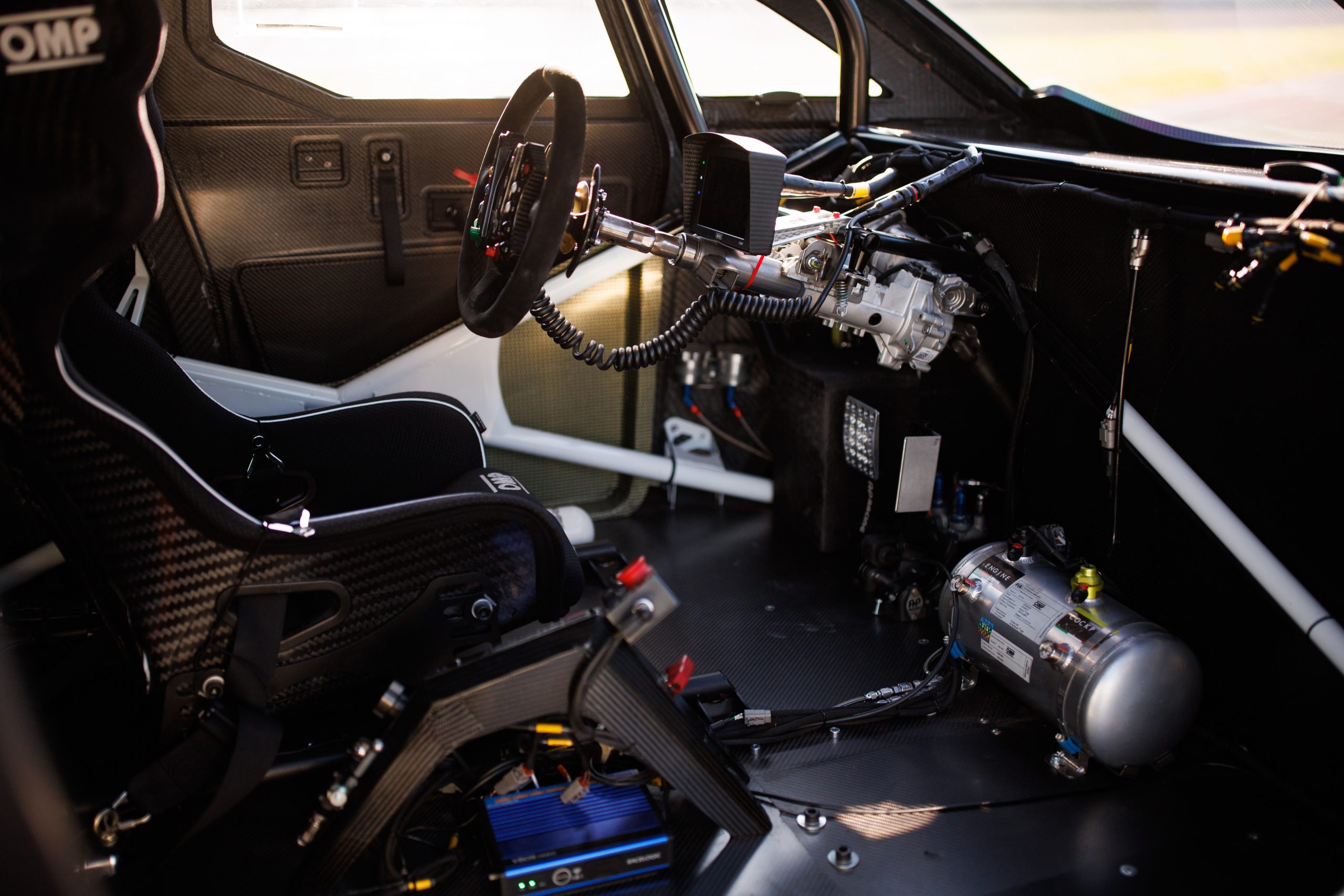 The Ford Supervan interior. It's got a roll cage and a carbon fiber racing seat.