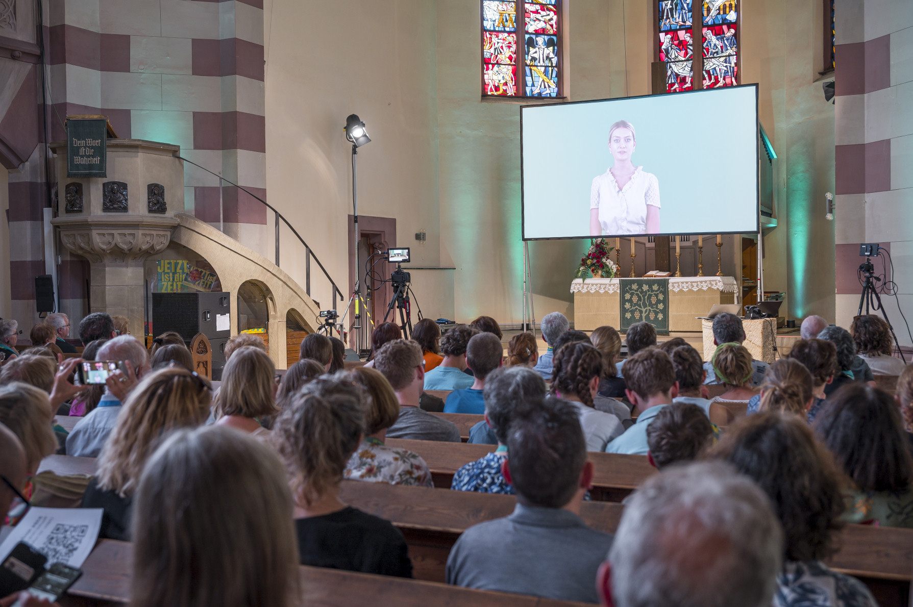 Visitors and attendees during the AI-created worship service in Fürth, Bavaria. In St. Paul Church, a service created by ChatGPT.