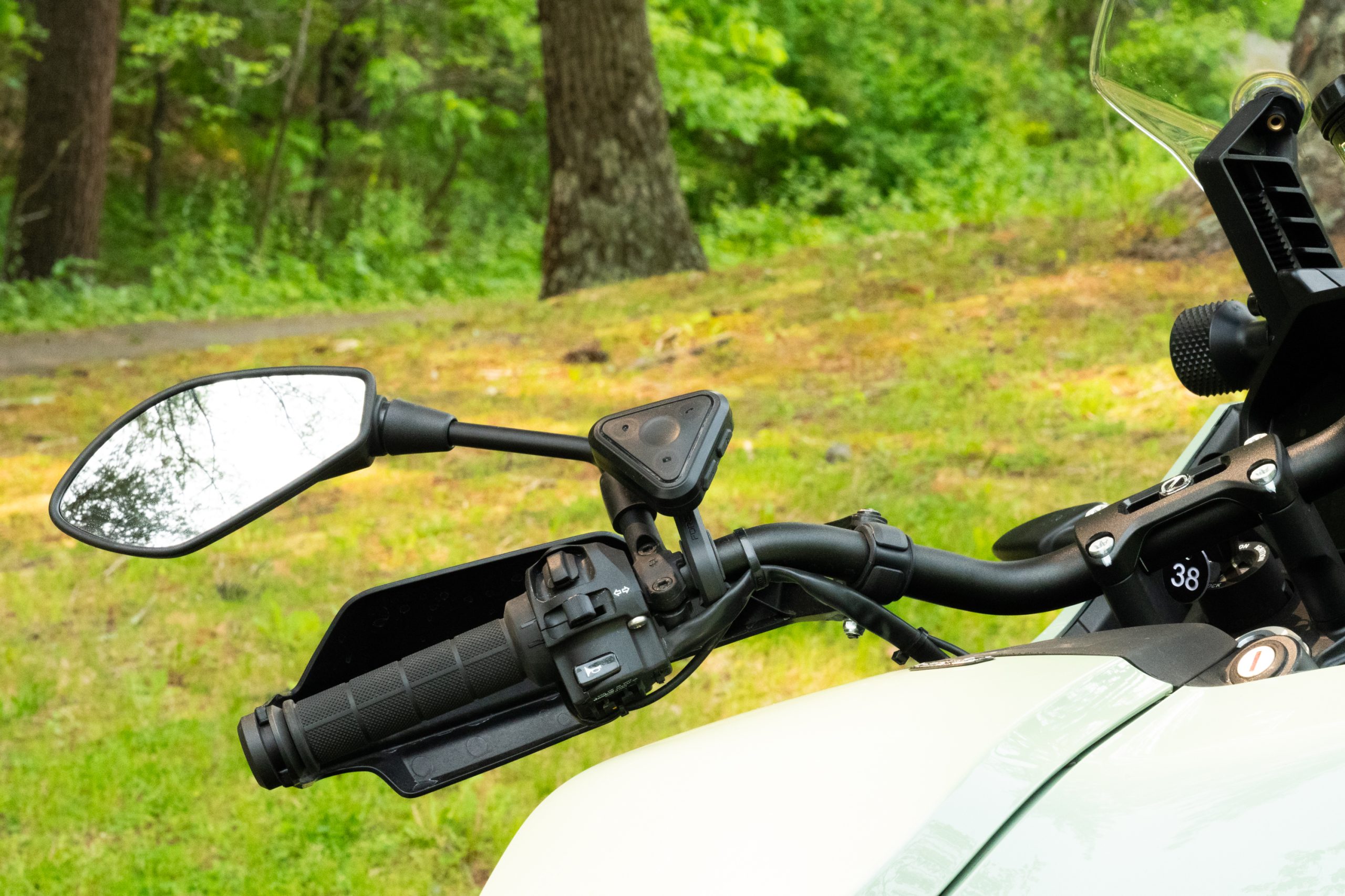 Motorcycle handlebars with a triangular controller attached