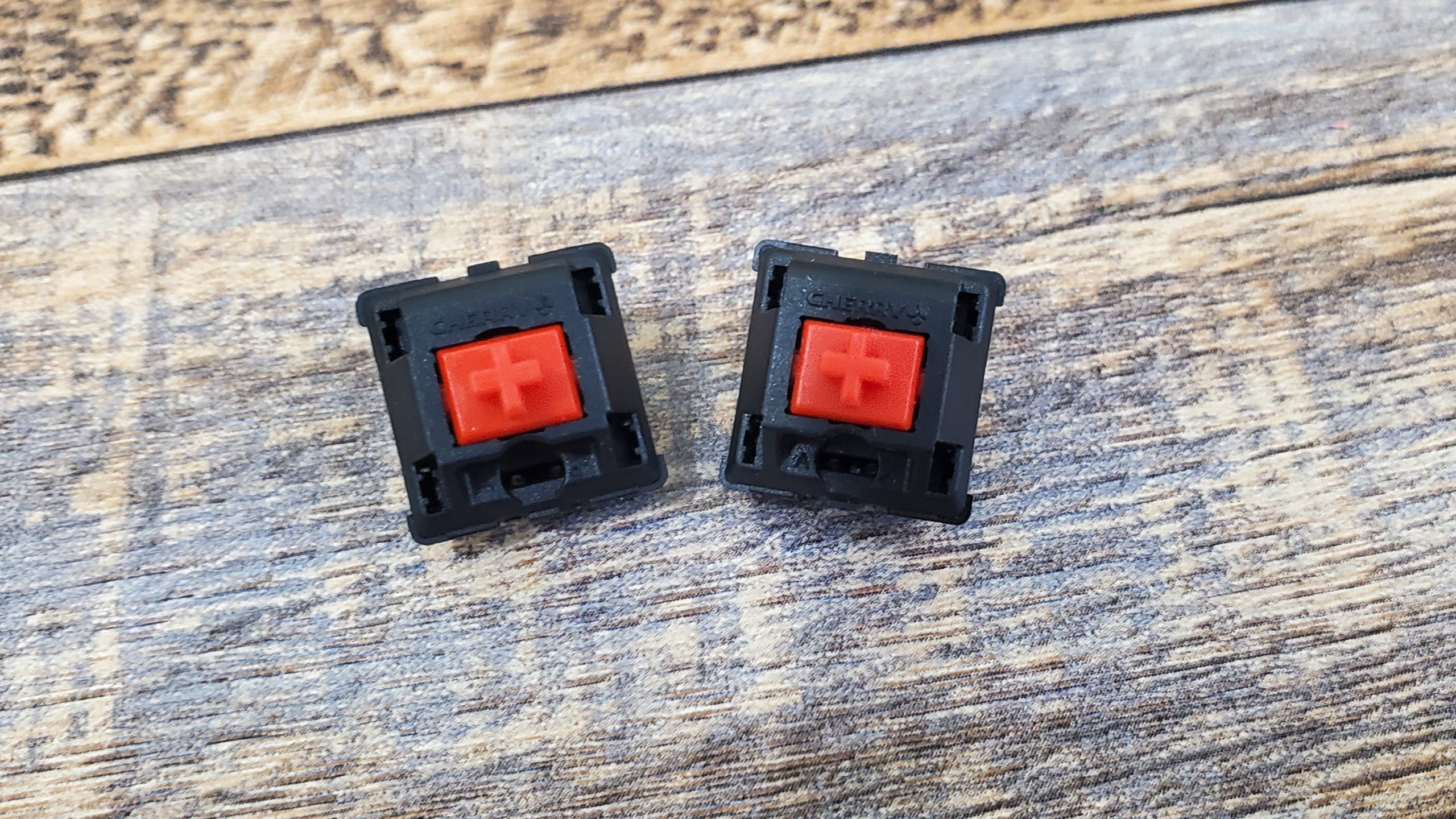 Cherry MX2A Red switch next to Cherry MX Red switch