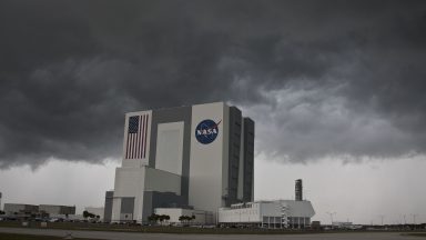 Storm clouds roll past NASA's VAB or Vehicle Assembly Building at Kennedy Space Center in Houston.