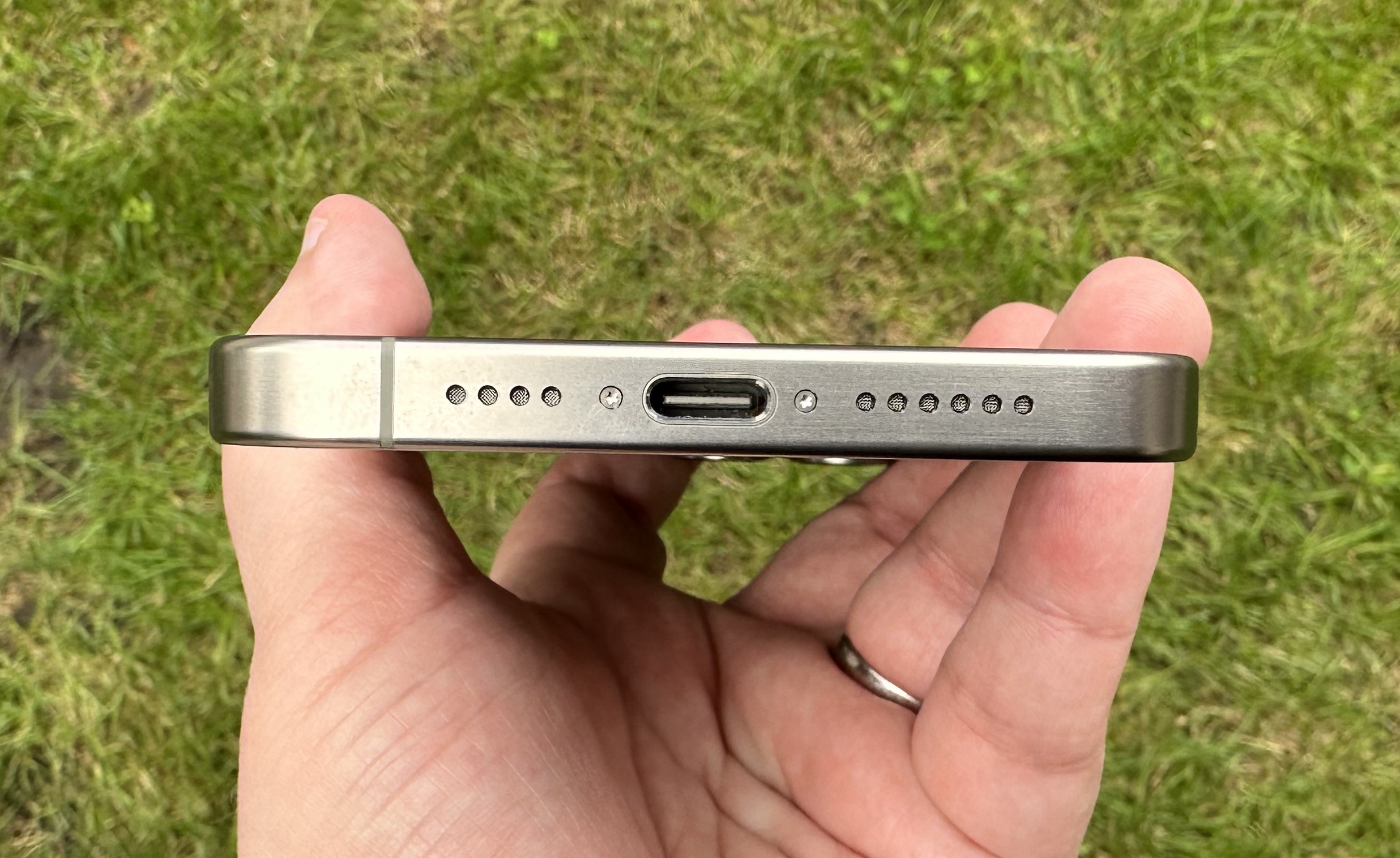 A USB-C port at the bottom of an iPhone