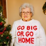 An AI-generated image of a grandma wearing a "Go big or go home sweatshirt" generated by Stable Diffusion 3.